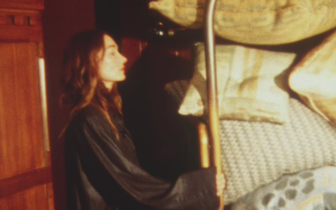 Kelly with a stack of 20 pillows